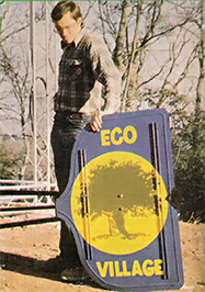 Wind power advocate Michael Hackleman shows off the tail logo.